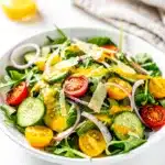 Fresh spring mix salad with lemon vinaigrette in a bright homemade close up