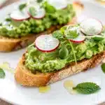 Spring pea crostini recipe with creamy spread on crispy toasted bread