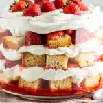 Layered strawberry shortcake trifle with juicy berries and creamy whipped cream.