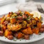 Savory corned beef hash with crispy sweet potatoes in a cast iron skillet