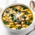 Creamy white bean kale soup recipe with a savory rich broth and rustic bread