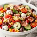 Colorful Italian antipasto salad with mozzarella pearls and crisp fresh vegetables.