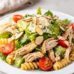 Creamy chicken Caesar pasta salad with romaine lettuce and cherry tomatoes
