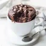 Moist single serving chocolate mug cake with melty chocolate chips dessert