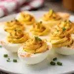 Classic deviled eggs recipe with creamy filling and paprika garnish close up