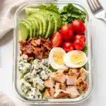 Cobb salad meal prep bowl with avocado bacon and blue cheese