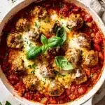 Cozy turkey meatball marinara skillet with melted cheese and fresh basil garnish