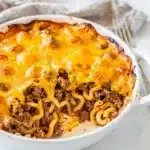Creamy ground beef casserole with egg noodles and melted cheddar cheese.