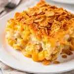 Creamy crockpot hashbrown casserole with melted cheddar and crispy onions.