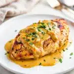 Creamy Dijon chicken recipe with golden seared breast in mustard sauce.