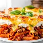 Easy weeknight pasta bake with ground beef, marinara, and melted cheese.