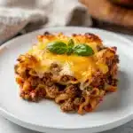 Hearty family ground beef casserole with pasta and melted golden cheese.
