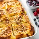 Family overnight French toast bake with crispy bacon and tart berry compote.