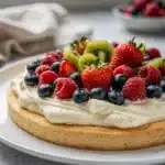 Make ahead fruit pizza with cream cheese frosting and fresh glazed berries.