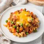 Crowd favorite ground beef casserole with noodles vegetables and melted cheese