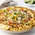 Creamy holiday Mexican street corn dip with charred corn and cotija cheese