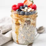 Make ahead overnight oats in a jar with fresh berries and almond slices.