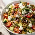 Creamy orzo salad with feta cheese tomatoes olives and fresh dill