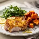 Crispy parmesan crusted pork chops with fresh herbs and arugula salad