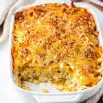 Creamy cheesy hashbrown casserole with a crispy golden cornflake topping