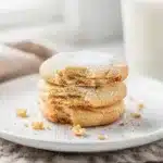 Classic soft sugar cookies with creamy frosting and colorful sprinkles close up