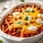 Easy pasta bake recipe with ground beef and melted cheese for family dinners