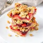 Strawberry crumble bars with a glossy filling and crispy oat topping.
