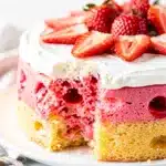 Moist yellow cake with red jello and whipped cream strawberry dessert