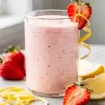 Creamy strawberry lemonade smoothie recipe in a vibrant close up photo