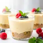 Sweet no bake cheesecake cups with creamy filling and graham cracker crust.