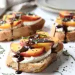 Balsamic peach crostini recipe with mozzarella on toasted rustic baguette