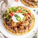 BBQ Chicken Tostadas with melted cheese and creamy beans