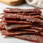 Top round beef slices marinated for perfect jerky texture