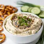 Creamy everything bagel dip with chives and seasoning for dipping vegetables