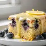 Lemon blueberry sheet cake with moist crumb and creamy lemon glaze