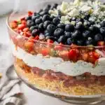 Patriotic red white blue layered dip recipe for Fourth of July celebrations