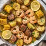 Sheet pan shrimp boil with buttered shrimp sausage corn and potatoes