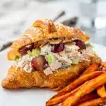 Creamy Sonoma chicken salad with red grapes and toasted almonds close up.