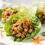 Glazed turkey lettuce wraps, creamy filling, crisp edges, vibrant close-up.